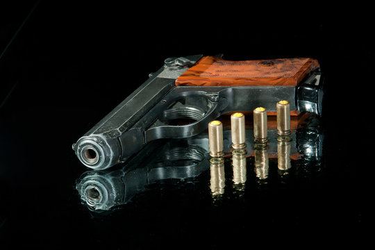 gun with four bullet and water
