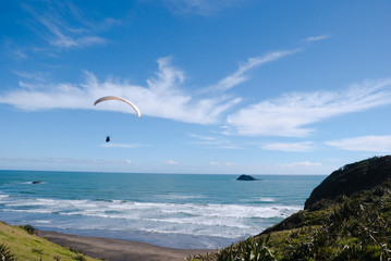 Paraglider over the Ocean Beach