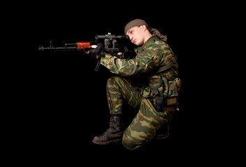 Soldier in uniform with rifle