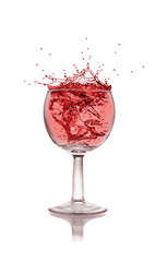 Glass with red wine splash