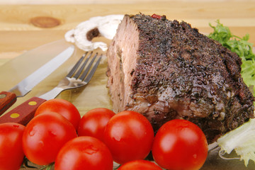 beef on transparent plate with peppers