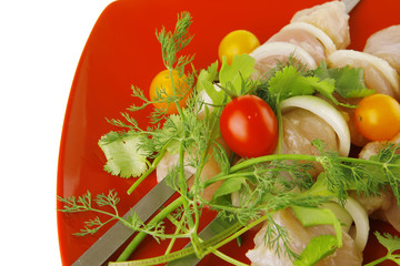 kebabs served on red plate