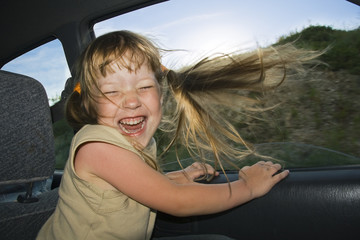 Love the Speed. Girl in the car at an open window.