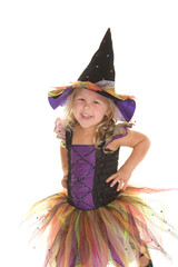 Adorable little girl dressed as a witch for Halloween smiling