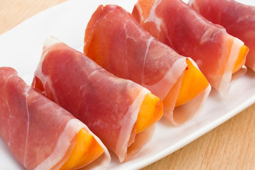 Slices of peach in Prosciutto Italian cured ham