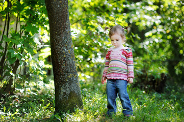 Adorable toddler in an autumn park