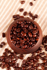 coffee beans inround wooden bowl