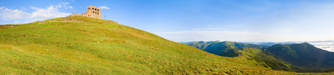 Summer mountain view with observatory ruins on mountain top