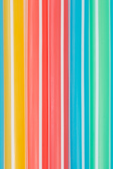 Colorful drinking straws close-up background
