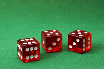 set of three dice on green