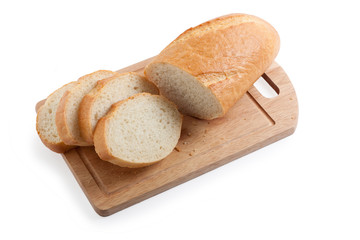 A long loaf sliced on a cutting board