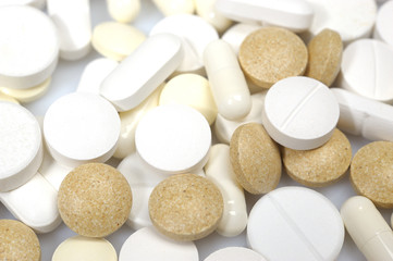 Group of medical pills and vitamins. can be used as background
