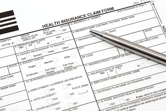 Health Insurance Claim Form With Silver Pen