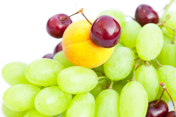 grapes cherry apricot  isolated on white