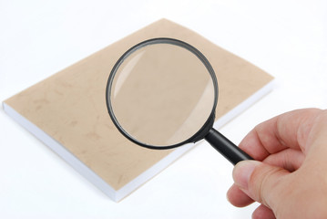 magnifying glass focusing on book