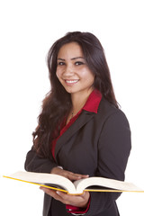 Girl with book looking smiling