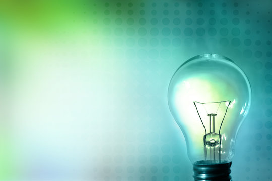 Light bulb and blue green background. Copy space