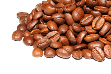 Close up of spilled coffee beans (on white background)