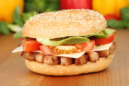 Closeup of a bagle with grilled chicken meat