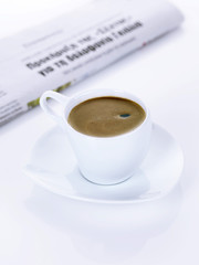 a greek coffee and a newspaper