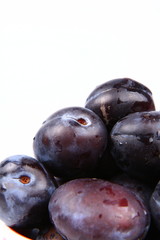 Plums in close up with space for text