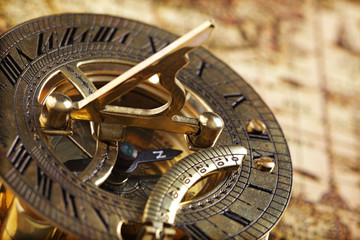 Antique brass compass and sundial - obrazy, fototapety, plakaty
