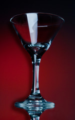 empty martini glasson a red