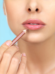 Portrait of beautiful woman she is doing makeup