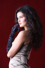 Beautiful brunette wearing black satin gloves - Fashion concept