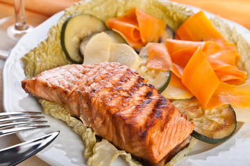 Salmon steak with steamed vegetables