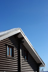 Blockhouse against a blue sky in the winter