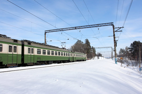Electric train against a blue sky in the winter