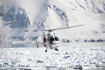 Helicopter over the frozen fjord
