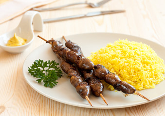Grilled chicken hearts with turmeric rice