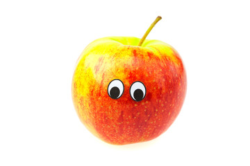 apples with eyes and faces isolated on white