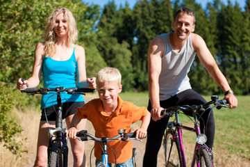 Family riding bicycles for sport