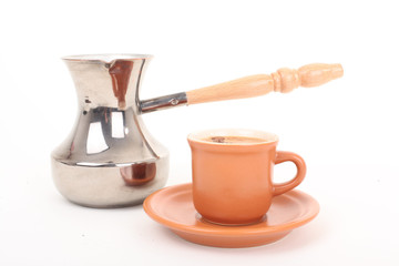 Turk and coffee cup on a white background