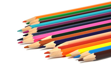 Assortment of colored pencils over white