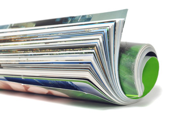 Roll of magazine isolated on white background
