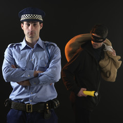 Policeman and thief. Robbery scene.