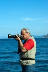 Obraz premium Professional photographer taking pictures