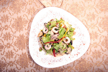 Salad made of different seafood and vegetables