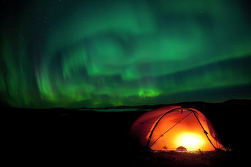aurora borealis with Tent in northern Sweden