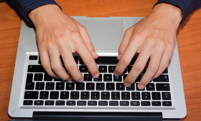 Fototapeta na wymiar Man Hand Typing on Computer Keyboard