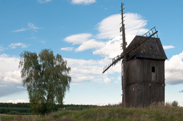 Old, weathered wooden windmill in Polish countryside