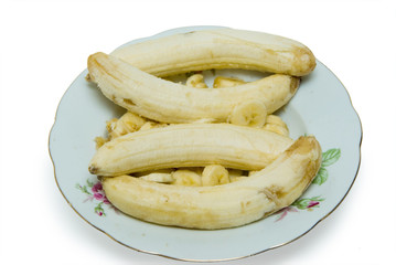 Freshly sliced bananas on a white background