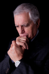 Portrait of a handsome mature businessman, thinking