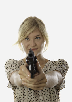 Young Woman Aiming A Revolver