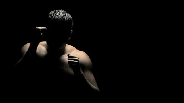 Boxer Spars in Shadows