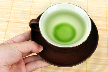 a cup of tea on bamboo tray